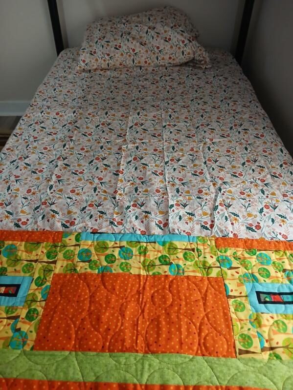 Colorful handmade quilts paired with fresh sheets at the Homeless Coalition of St. John's County