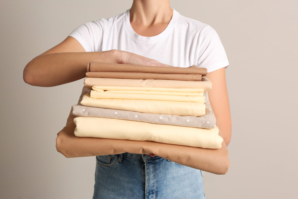 Neatly organized linens hanging and folded